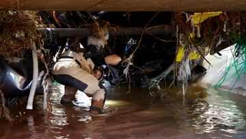 A search and rescue team member looks for bodies, following heavy rains that caused floods, in Chiva, Spain, November 2, 2024. REUTERS/Bruna Casas