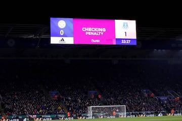 General view as a big screen displays a pending VAR decision