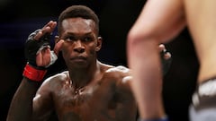 HOUSTON, TEXAS - FEBRUARY 12: Israel Adesanya of Nigeria looks on in his middleweight championship fight against Robert Whittaker of Australia during UFC 271 at Toyota Center on February 12, 2022 in Houston, Texas.   Carmen Mandato/Getty Images/AFP
== FOR NEWSPAPERS, INTERNET, TELCOS & TELEVISION USE ONLY ==