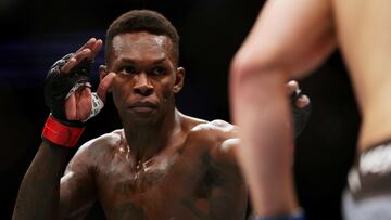 HOUSTON, TEXAS - FEBRUARY 12: Israel Adesanya of Nigeria looks on in his middleweight championship fight against Robert Whittaker of Australia during UFC 271 at Toyota Center on February 12, 2022 in Houston, Texas.   Carmen Mandato/Getty Images/AFP
== FOR NEWSPAPERS, INTERNET, TELCOS & TELEVISION USE ONLY ==