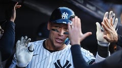 New York Yankees center fielder Aaron Judge (99) celebrates with teammates in the dugout after hitting a two-run home run in the first inning against the Oakland Athletics at Yankee Stadium. Mandatory Credit: Wendell Cruz-USA TODAY Sports