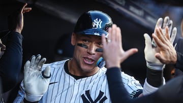 Apr 24, 2024; Bronx, New York, USA; New York Yankees center fielder Aaron Judge (99) celebrates with teammates in the dugout  after hitting a two run home run in the first inning against the Oakland Athletics at Yankee Stadium. Mandatory Credit: Wendell Cruz-USA TODAY Sports