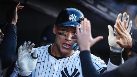 Apr 24, 2024; Bronx, New York, USA; New York Yankees center fielder Aaron Judge (99) celebrates with teammates in the dugout  after hitting a two run home run in the first inning against the Oakland Athletics at Yankee Stadium. Mandatory Credit: Wendell Cruz-USA TODAY Sports