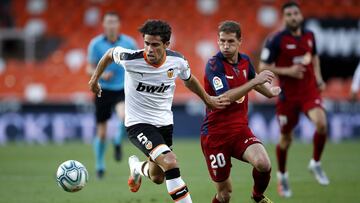 VALENCIA, SPAIN - JUNE 21: Gabriel Paulista of Valencia CF battles for possession with Darko Brasanac of CA Osasuna during the La Liga match between Valencia CF and CA Osasuna at Estadio Mestalla on June 21, 2020 in Valencia, Spain. (Photo by Eric Alons