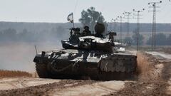 Israeli soldiers gesture in a tank, amid the ongoing conflict between Israel and the Palestinian Islamist group Hamas, near the Israel-Gaza Border, in Israel, May 6, 2024. REUTERS/Ammar Awad