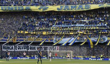 Boca Juniors' supporters cheer for their team during an Argentine first division Superliga football match against River Plate at "La Bombonera" stadium in Buenos Aires, Argentina, on September 23, 2018.