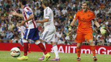 Raúl García, Coentrao y Casillas durante el partido