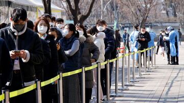 People wait in line to undergo the coronavirus disease (COVID-19) test at a temporary testing site set up at City Hall Plaza in Seoul, South Korea, February 10, 2022. REUTERS/ Heo Ran