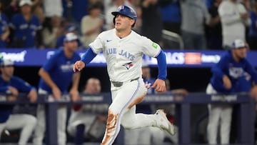 Oct 19, 2025; Toronto, Ontario, CAN; Toronto Blue Jays center fielder Daulton Varsho (5) runs home to score on an RBI single by third baseman Addison Barger (not pictured) in the second inning against the Seattle Mariners during game six of the ALCS round for the 2025 MLB playoffs at Rogers Centre. Mandatory Credit: John E. Sokolowski-Imagn Images
