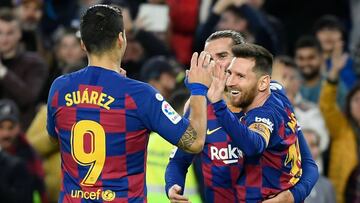 Barcelona's Argentine forward Lionel Messi (R) celebrates after scoring during the Spanish league football match FC Barcelona against Deportivo Alaves at the Camp Nou stadium in Barcelona on December 21, 2019. (Photo by LLUIS GENE / AFP)