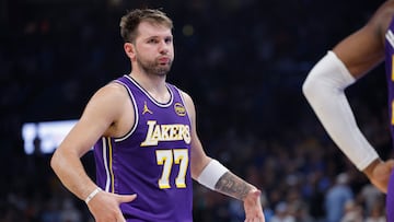 Los Angeles Lakers guard Luka Doncic reacts to a fan during the second quarter of a game against the Oklahoma City Thunder at Paycom Center.