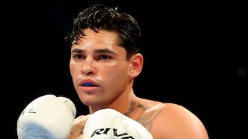 NEW YORK, NEW YORK - APRIL 20: Ryan Garcia (white trunks) prepares to fight Devin Haney during their WBC Super Lightweight title bout at Barclays Center on April 20, 2024 in New York City. Al Bello/Getty Images/AFP (Photo by AL BELLO / GETTY IMAGES NORTH AMERICA / Getty Images via AFP)