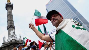 A man waves a Mexican flag in front of the Angel of Independence monument during a protest on the day of the judicial and magistrate elections, in Mexico City, Mexico June 1, 2025. REUTERS/Toya Sarno Jordan