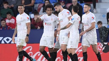 Sevilla's French defender Jules Kounde (2L) celebrates scoring his team's third goal during the Spanish League football match between Levante UD and Sevilla FC at the Ciutat de Valencia stadium in Valencia on April 21, 2022. (Photo by Jose Jorda