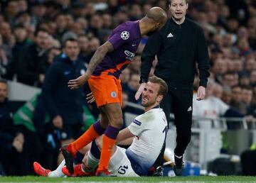 Harry Kane down injured and clutching his ankle during the Manchester City game.