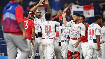 Panama's Johnny Yussef Santos celebrates with teammates after scoring during the Caribbean Series baseball game between Panama and Puerto Rico at LoanDepot Park in Miami, Florida, on February 5, 2024. (Photo by Chandan Khanna / AFP)