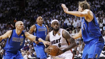 Miami Heat&#039;s LeBron James (C) drives past Dallas Mavericks&#039; Jason Kidd (L) and Dirk Nowitzki (R) as Shawn Marion follows the play 
 during the first half of Game 6 of the NBA Finals basketball series in Miami, June 12, 2011. REUTERS/Hans Deryk (UNITED STATES  - Tags: SPORT BASKETBALL)