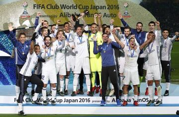 Real Madrid's Sergio Ramos and team mates celebrate winning the FIFA Club World Cup Final with the trophy