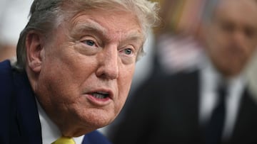 US President Donald Trump speaks to the press in the Oval Office of the White House as members of Italian soccer club Juventus pay a visit in Washington, DC, on June 18, 2025. Juventus will play Emirati club Al-Ain in the 2025 FIFA Club World Cup at Washington's Audi Field later in the day. (Photo by Brendan SMIALOWSKI / AFP)