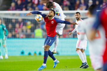 Spain's defender Sergio Ramos (Up) and Norway's forward Joshua King vie for the ball during the Euro 2020 qualifying football match Norway v Spain in Oslo, Norway on October 12, 2019. (Photo by Tore Meek / NTB Scanpix / AFP) / Norway OUT