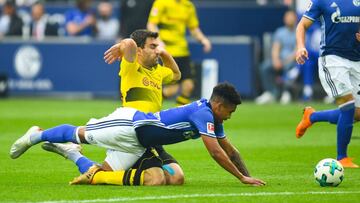 Schalke&#039;s US midfielder Weston McKennie and Dortmund&#039;s Greek defender Sokratis vie for the ball during the German first division Bundesliga football match FC Schalke 04 vs Borussia Dortmund, in Gelsenkirchen, western Germany, on April 15, 2018. 