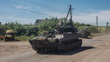 LUHANSK, UKRAINE - JUNE 6: An Ukrainian soldier drives tank on a road in Luhansk, Ukraine on June 6, 2022. (Photo by Diego Herrera Carcedo/Anadolu Agency via Getty Images)