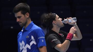 Tennis - ATP Finals - The O2, London, Britain - November 21, 2020 Austria&#039;s Dominic Thiem drinks from a bottle of water during his semi-final match against Serbia&#039;s Novak Djokovic REUTERS/Toby Melville