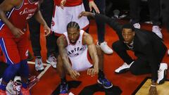 May 12, 2019; Toronto, Ontario, CAN; Philadelphia 76ers center Joel Embiid (21) and Toronto Raptors forward Kawhi Leonard (2) wait for the game winning basket by Leonard to drop in during game seven of the second round of the 2019 NBA Playoffs at Scotiabank Arena. Toronto defeated Philadelphia. Mandatory Credit: John E. Sokolowski-USA TODAY Sports