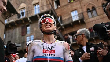 Team UAE's Slovenain rider Tadej Pogacar celebrates after winning the 19th one-day classic 'Strade Bianche' (White Roads) men's cycling race between Siena and Siena in Tuscany on March 8, 2025. (Photo by Marco BERTORELLO / AFP)