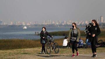 People enjoy the day at the shore of the Rio de la Plata river, amid the coronavirus disease (COVID-19), in Buenos Aires, Argentina August 12, 2020. REUTERS/Agustin Marcarian