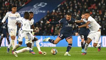 PARIS, FRANCE - FEBRUARY 15: Kylian Mbappe of Paris Saint-Germain shoots during the UEFA Champions League Round Of Sixteen Leg One match between Paris Saint-Germain and Real Madrid at Parc des Princes on February 15, 2022 in Paris, France. (Photo by Shaun