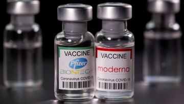 FILE PHOTO: Vials with Pfizer-BioNTech and Moderna coronavirus disease (COVID-19) vaccine labels are seen in this illustration picture taken March 19, 2021. REUTERS/Dado Ruvic/File Photo