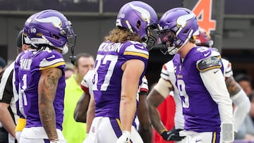 MINNEAPOLIS, MINNESOTA - DECEMBER 07: J.J. McCarthy #9 celebrates with T.J. Hockenson #87 of the Minnesota Vikings after a touchdown during the second half against the Washington Commanders at U.S. Bank Stadium on December 07, 2025 in Minneapolis, Minnesota. Ellen Schmidt/Getty Images/AFP (Photo by Ellen Schmidt / GETTY IMAGES NORTH AMERICA / Getty Images via AFP)