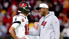 TAMPA, FLORIDA - JANUARY 16: Tom Brady #12 and offensive coordinator Byron Leftwich of the Tampa Bay Buccaneers talk on the field prior to a game against the Dallas Cowboys in the NFC Wild Card playoff game at Raymond James Stadium on January 16, 2023 in Tampa, Florida.   Julio Aguilar/Getty Images/AFP (Photo by Julio Aguilar / GETTY IMAGES NORTH AMERICA / Getty Images via AFP)