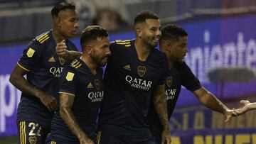 Boca Juniors' forward Carlos Tevez (C) celebrates with teammates after scoring the team's fifth goal against Velez Sarsfield during their Argentine Professional Football League match at La Bombonera stadium in Buenos Aires, on March 7, 2021. (Ph