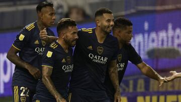 Boca Juniors&#039; forward Carlos Tevez (C) celebrates with teammates after scoring the team&#039;s fifth goal against Velez Sarsfield during their Argentine Professional Football League match at La Bombonera stadium in Buenos Aires, on March 7, 2021. (Ph