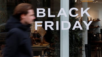 A man walks past a Black Friday sale sign displayed on a shop window in Paris, France, November 26, 2025. REUTERS/Stephanie Lecocq