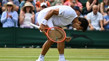 Chile's Cristian Garin celebrates after winning a game against Australia's Alex De Minaur during their round of 16 men's singles tennis match on the eighth day of the 2022 Wimbledon Championships at The All England Tennis Club in Wimbledon, southwest London, on July 4, 2022. (Photo by SEBASTIEN BOZON / AFP) / RESTRICTED TO EDITORIAL USE