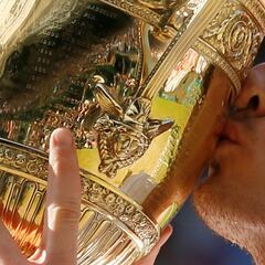 What is the Wimbledon trophy called, how much is it worth and what is it made of?