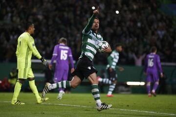 Coentrao (number 15) hangs his head in dejection after Sporting's equaliser.
