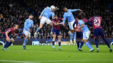 Manchester City's Norwegian striker #09 Erling Haaland headers the ball during the UEFA Champions League Group G football match between Manchester City and RG Leipzig at the Etihad Stadium, in Manchester, north west England, on November 28, 2023. (Photo by Oli SCARFF / AFP)