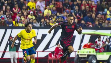 Alejandro Zendejas (L) of America fights for the ball with Christian Rivera (R) of Tijuana during the 13th round match between Tijuana and America as part of the Liga BBVA MX, Torneo Apertura 2024 at Caliente Stadium on October 23, 2024 in Tijuana, Baja California, Mexico.