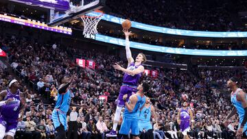 Utah Jazz forward Lauri Markkanen (23) shoots the ball over Phoenix Suns guard Devin Booker (1) in the second quarter at Vivint Arena.