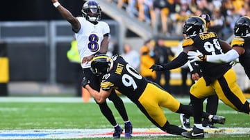 PITTSBURGH, PENNSYLVANIA - NOVEMBER 17: Lamar Jackson #8 of the Baltimore Ravens attempts pass while being hit by T.J. Watt #90 of the Pittsburgh Steelers in the third quarter of a game at Acrisure Stadium on November 17, 2024 in Pittsburgh, Pennsylvania. Joe Sargent/Getty Images/AFP (Photo by Joe Sargent / GETTY IMAGES NORTH AMERICA / Getty Images via AFP)