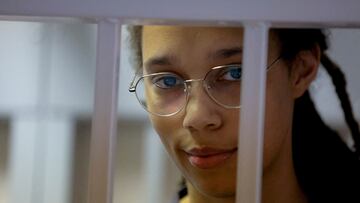 FILE PHOTO: U.S. basketball player Brittney Griner, who was detained at Moscow's Sheremetyevo airport and later charged with illegal possession of cannabis, stands inside a defendants' cage before a court hearing in Khimki outside Moscow, Russia August 4, 2022. REUTERS/Evgenia Novozhenina/Pool/File Photo