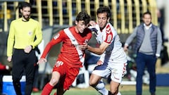 LEON, SPAIN - JANUARY 28:  Angel Garcia of Cultural Leonesa duels for the ball with Marc Gual of Sevilla II during La Liga 2 play off round between Cultural Leonesa and Sevilla II at Reino de Leon Stadium on January 28, 2018 in Leon, Spain.  (Photo by Jua