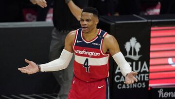 Washington Wizards guard Russell Westbrook and coach Scott Brooks question an official about a call during the second half of the team's NBA basketball game against the Los Angeles Clippers on Tuesday, Feb. 23, 2021, in Los Angeles. The Clippers won 135-116. (AP Photo/Mark J. Terrill)