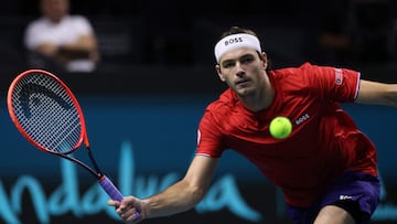 Taylor Fritz of Team USA returns a shot to Alex de Minaur of Team Australia during their quarter-final singles match between USA and Australia at the Davis Cup Finals at the Palacio de Deportes Jose Maria Martin Carpena arena in Malaga, southern Spain, on November 21, 2024. (Photo by Thomas COEX / AFP)