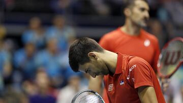 Novak Djokovic reacts during the doubles rubber. 