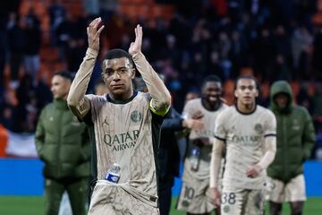 Mbappe (L) of PSG waves to fans 